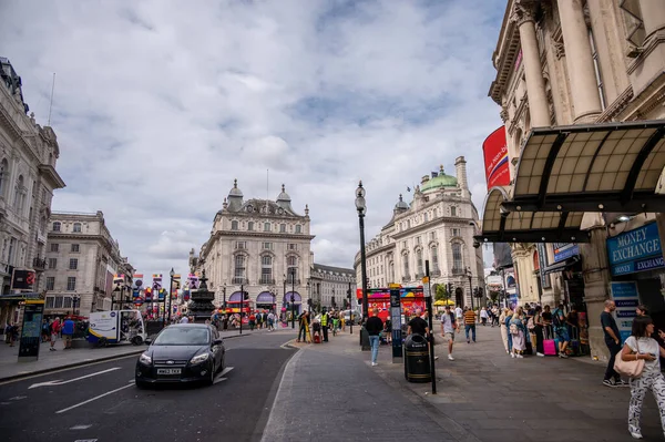 London, UK - August 22, 2022: People and traffic on the Picadilly Circus. This is a famous place in London's West End it was built in 1819 to join Regent Street with the shopping street of Picadilly.