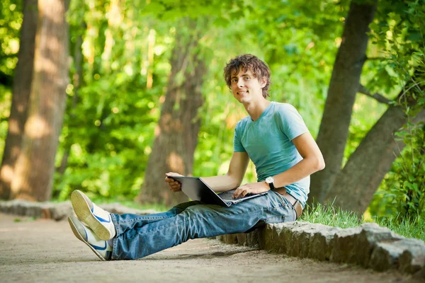 Happy man with a laptop Stock Image