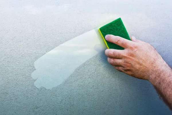 Cleaning car using a cleaning sponge