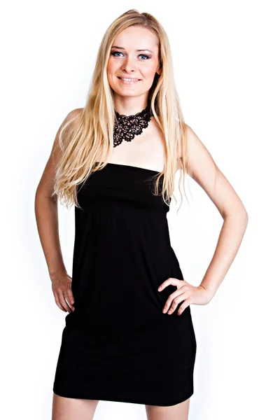 A woman in a black cocktail dress — Stock Photo, Image