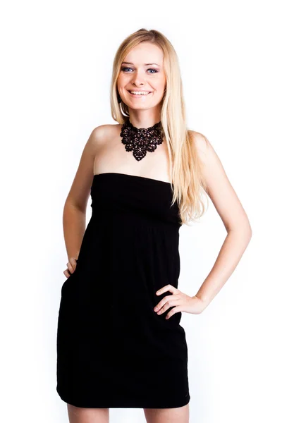 A woman in a black cocktail dress — Stock Photo, Image