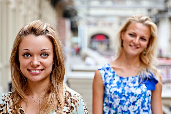 Two women in a shopping center