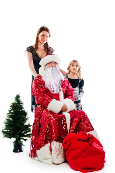 Papai Noel e mãe e filha — Fotografia de Stock
