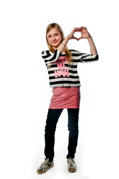 Girl shows fingers heart — Stock Photo, Image