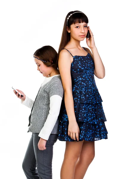 Two girls talking on the phone — Stock Photo, Image