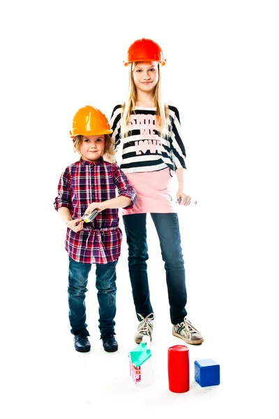 Dos chicas en cascos de construcción — Foto de Stock