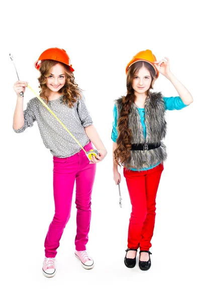 Two girls in construction helmets — Stock Photo, Image