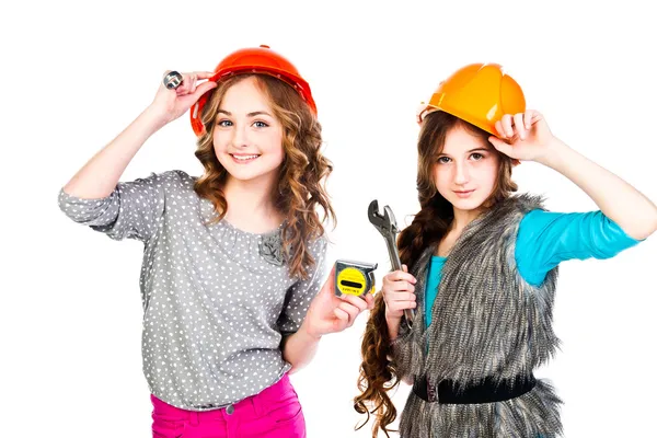 Two girls in construction helmets — Stock Photo, Image