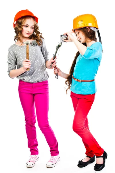 Two girls in construction helmets — Stock Photo, Image