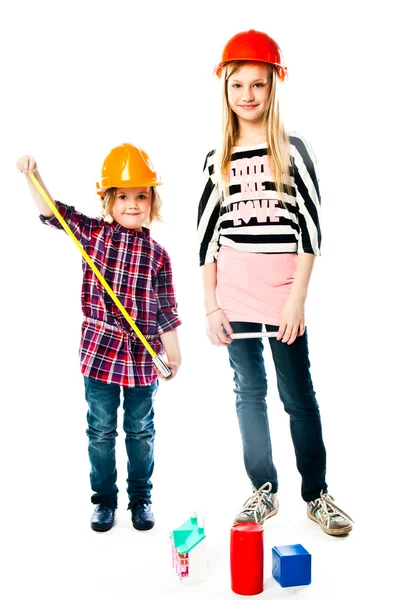 Two girls in construction helmets — Stock Photo, Image