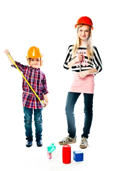 Two girls in construction helmets — Stock Photo, Image