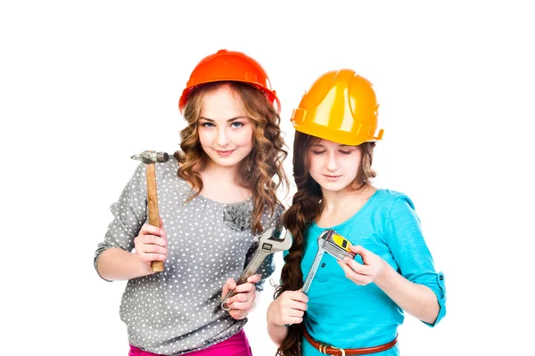 Two girls in construction helmets — Stock Photo, Image