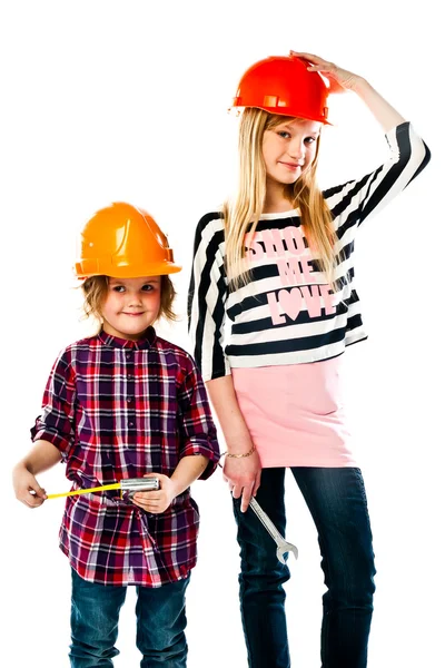Two girls in construction helmets — Stock Photo, Image