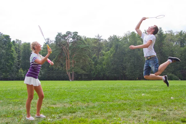 A man playing a woman in badminton — Stock Photo, Image