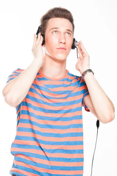 Man listens to music on headphones — Stock Photo, Image