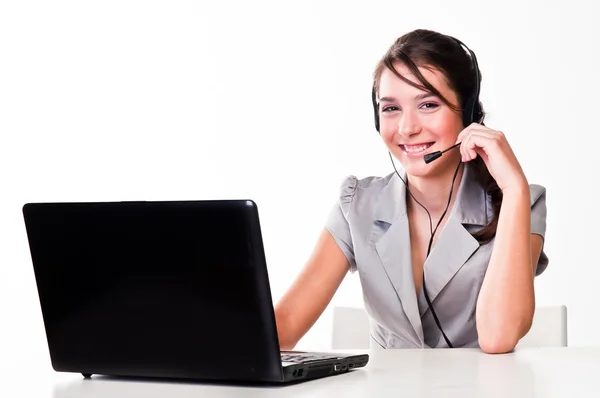 Girl with a laptop and headset — Stock Photo, Image