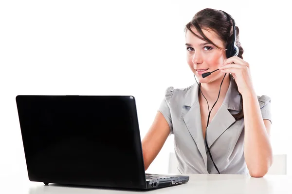 Girl with a laptop and headset — Stock Photo, Image