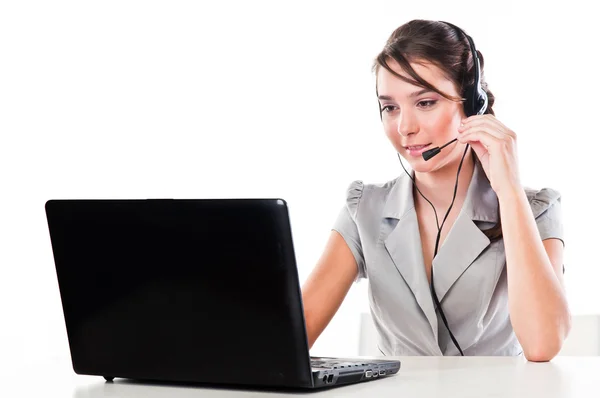 Girl with a laptop and headset Stock Photo