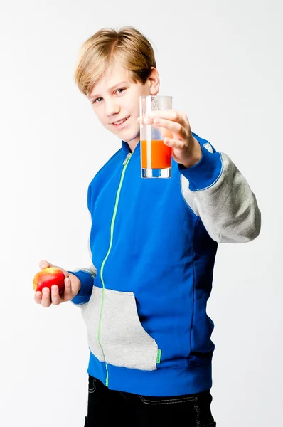 Boy with an apple and juice — Stock Photo, Image