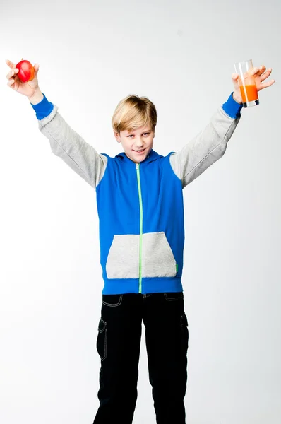 Boy with an apple and juice — Stock Photo, Image