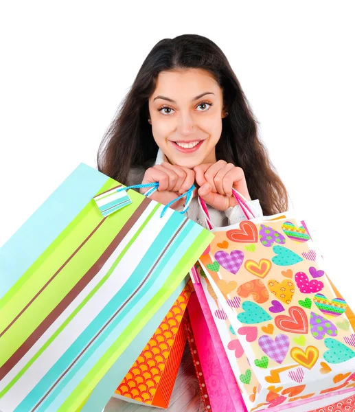 Portrait of an enthusiastic woman with packages in hands isolate — Stock Photo, Image