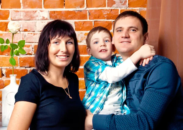 Portrait of a young family in studio — Stock Photo, Image