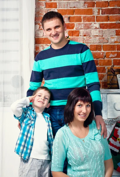 Portrait of a young family in studio — Stock Photo, Image