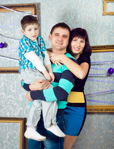 Portrait of a young family in studio — Stock Photo, Image