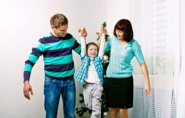 Young family having fun in the New Year — Stock Photo, Image