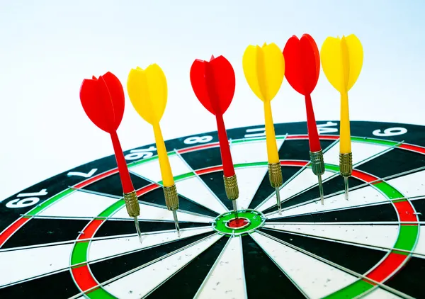 Some darts on the board — Stock Photo, Image