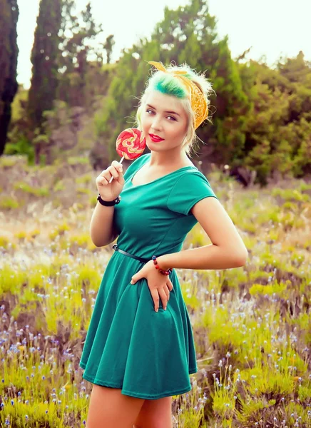 Creative girl with a bright lollipop — Stock Photo, Image