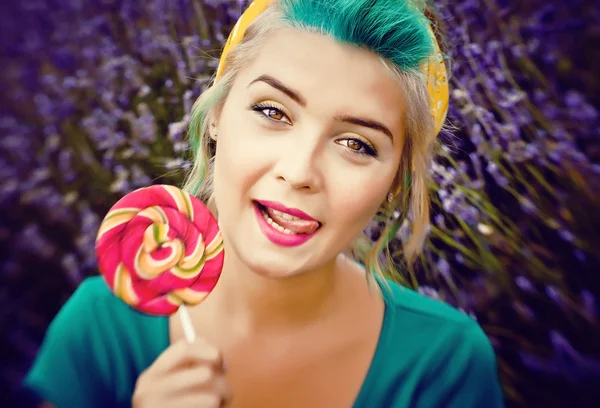 Creative girl with a bright lollipop — Stock Photo, Image