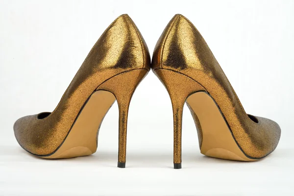 Pair of golden colored High Heel — Stock Photo, Image