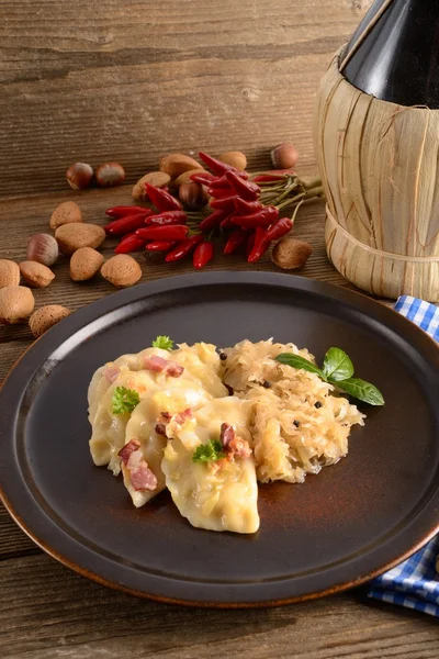 Pierogi.Polish dish pierogi with sauerkraut and mushrooms — Stock Photo, Image