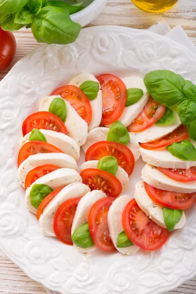 Tomato with mozzarella cheese — Stock Photo, Image