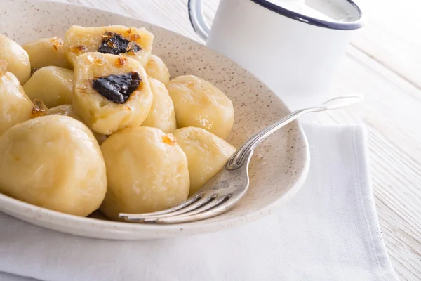 Potato dumplings with plums full — Stock Photo, Image