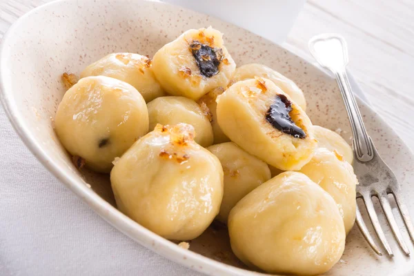 Potato dumplings with plums full — Stock Photo, Image