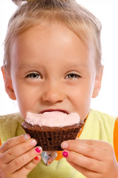 Kleine Mädchen und Muffin — Stockfoto