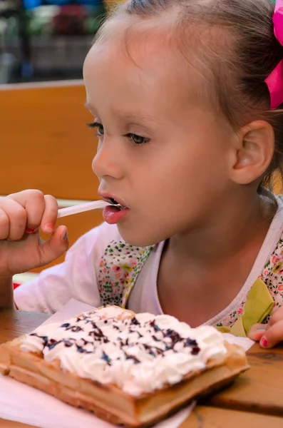 Small girls in waffle food — Stock Photo, Image