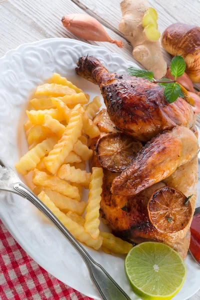 Chickens with French fries — Stock Photo, Image