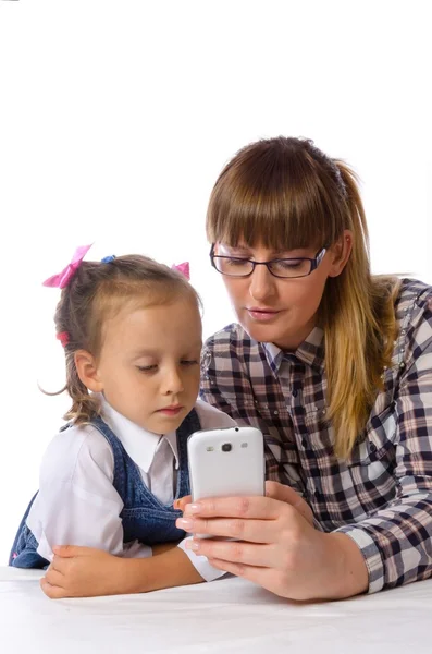 Mother and daughter with mobile phone — Stock Photo, Image