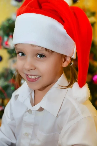 Small girl in Santa hat — Stock Photo, Image