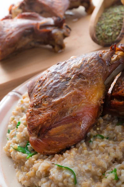 Roasted goose thighs with grits — Stockfoto