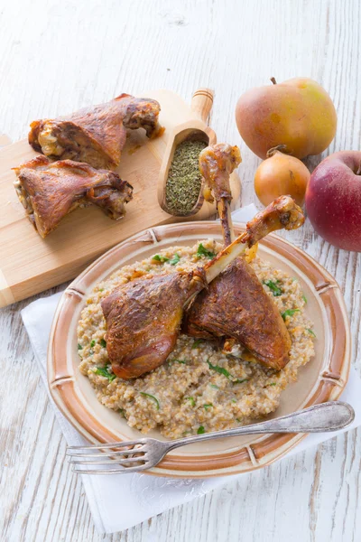 Roasted goose thighs with grits — Stok fotoğraf