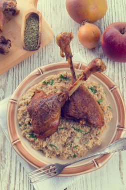 Roasted goose thighs with grits