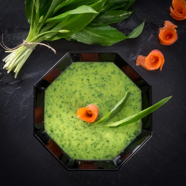 Garlic soup with smoked salmon — Stock Photo, Image