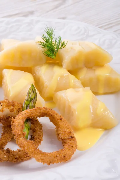 Onion rings with potato dumpling — Stock Photo, Image