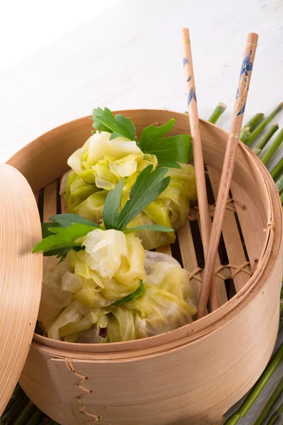 Cabbage with rice bags — Stock Photo, Image