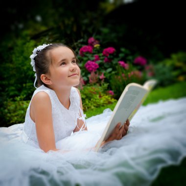 Girl reading First Holy Communion clipart