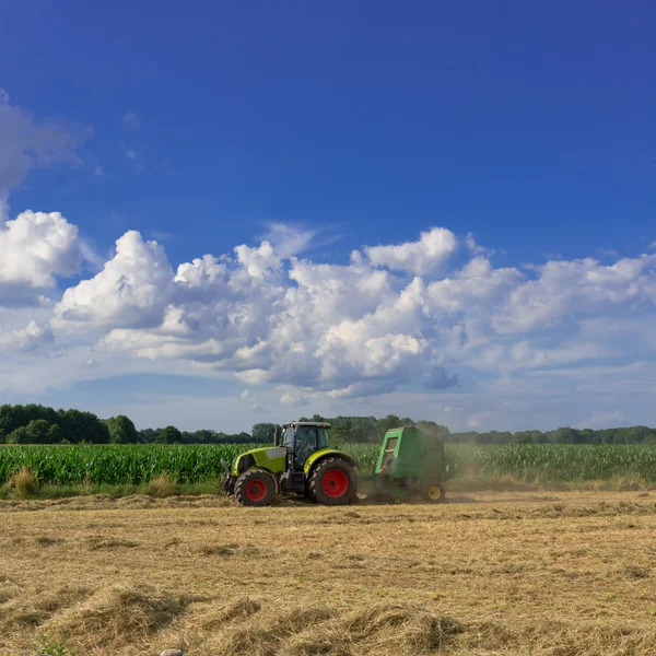 Tractors harvesting — Stock Photo, Image